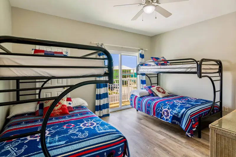 Side A · Bunk room at Beachfront Duplex: 2 twin-over-double bunk beds