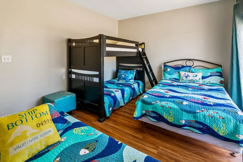 Side B · Bunk room at Beachfront Duplex: Bunk bed, double and single bed